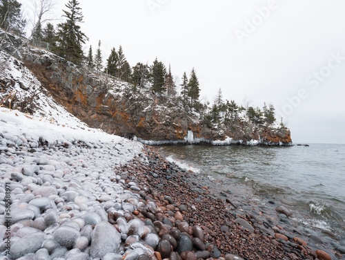 Ice coated pebbles along the shoreline of Lake Superior at the Tettegouche State Park, MN photo