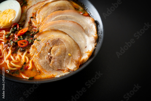 Fototapeta Naklejka Na Ścianę i Meble -  Ramen Noodles Spicy Tomyum Soup with Roast Pork