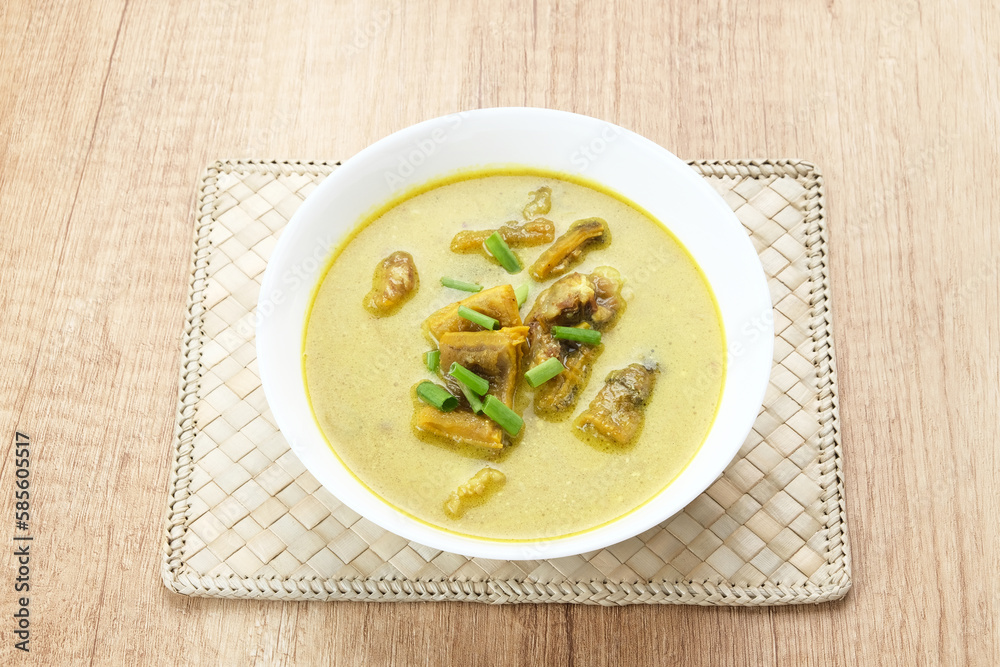 Empal Gentong Cirebon, traditional beef soup with coconut milk. Indonesian food
Empal Gentong Cirebon, traditional beef soup with coconut milk. Indonesian food
