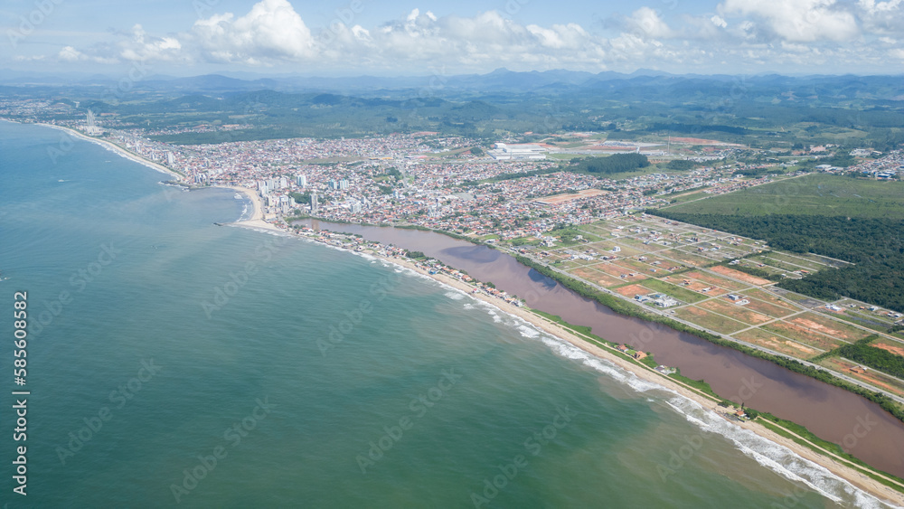 Aerial view of the beach in the city of Barra Velha in Santa Catarina. Beach unsuitable for swimming. Beach pollution.