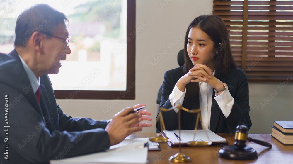 Legal and justice concept, Senior lawyer explains and provide legal advice to young female lawyer Legal and justice concept, Senior lawyer explains and provide legal advice to young female lawyer