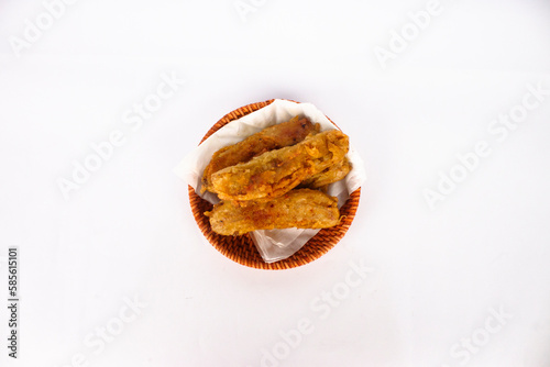 A bowl of fried bananas isolated on white background