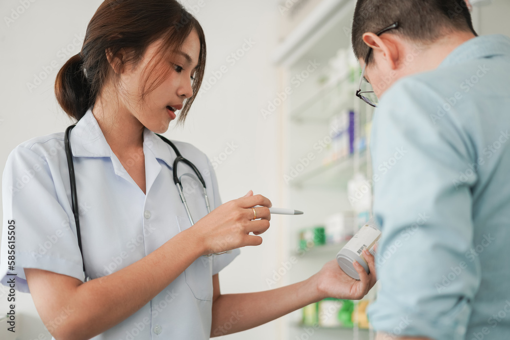 Medicine and health concept, Female pharmacist hold pill bottle to explaining medication for client Medicine and health concept, Female pharmacist hold pill bottle to explaining medication for client