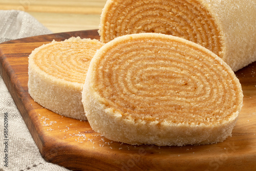 Focus on Brazilian roll cake of dulce de leche.