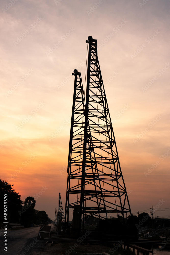 silhouette high voltage pole on sky sunset background.	