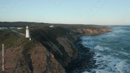 An aerial top down sunset shot of Cape Otway lighthouse, along the coastline, Abollo Bay, Australia