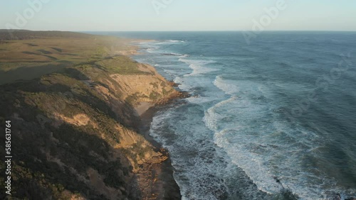 An aerial top down sunset shot of Cape Otway lighthouse, along the coastline, Abollo Bay, Australia