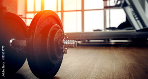 dumbbells in the gym in the sunlight