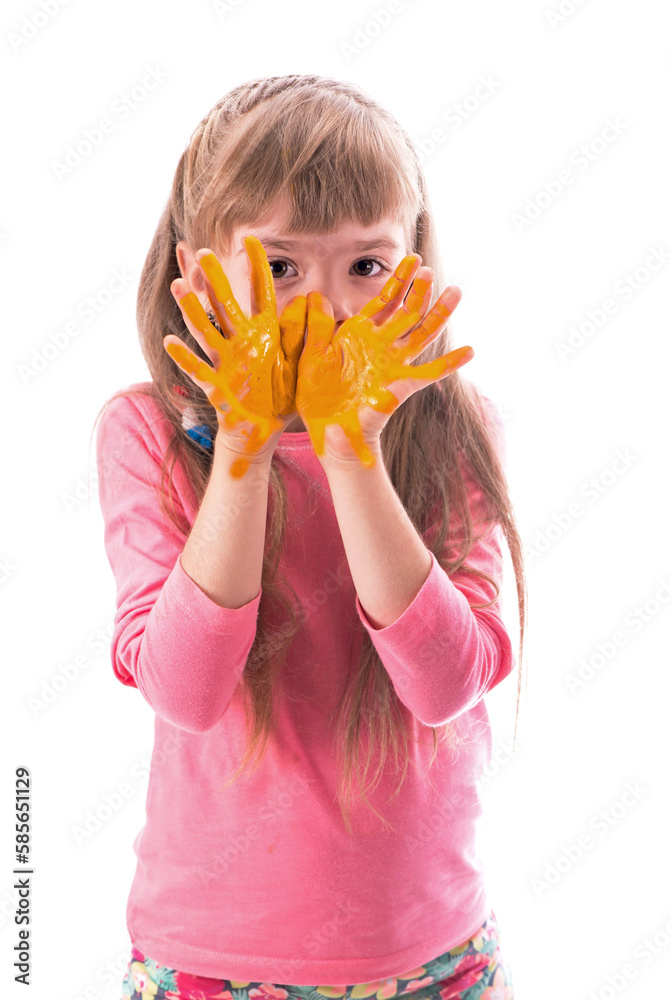 The child is drawing. Children's painting. Little girl draws the sun. Paint on children's hands. Creative little artist at work.Isolated on a white background The child is drawing. Children's painting. Little girl draws the sun. Paint on children's hands. Creative little artist at work.Isolated on a white background