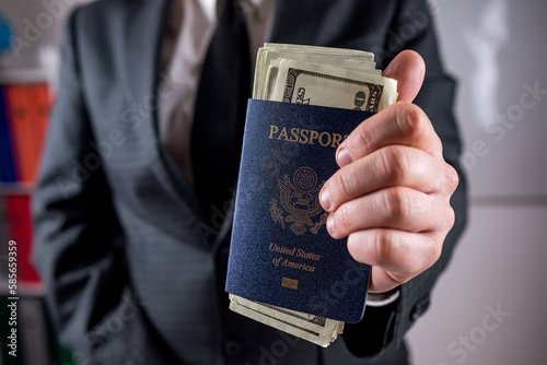 Business man hold USA passport with dollar for traveler