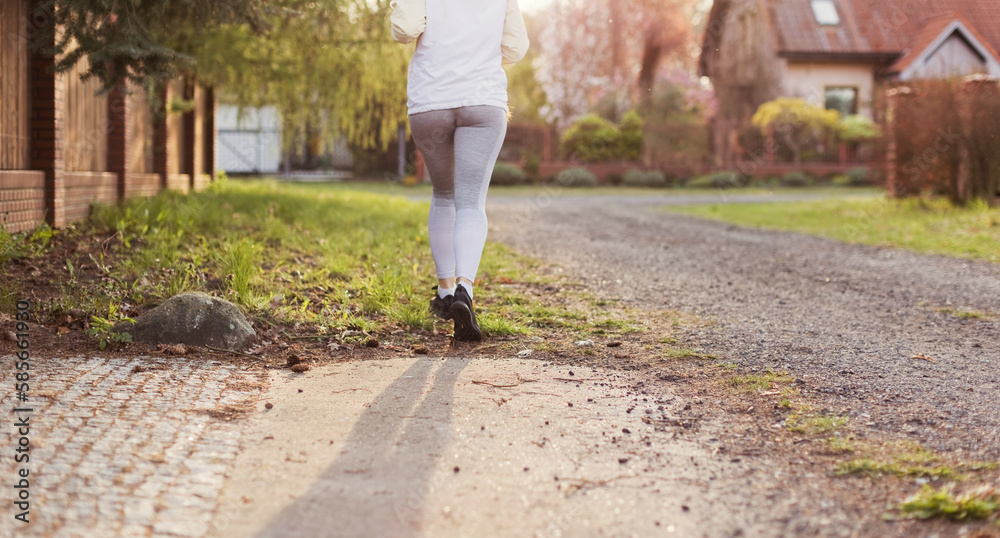 Fototapeta premium Running woman outdoors at sunlight