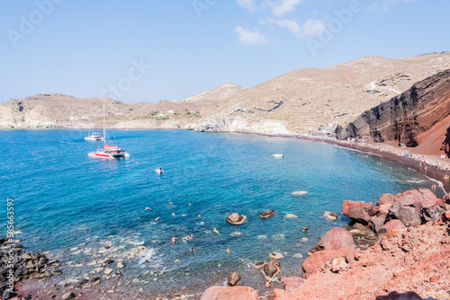 The red earth of the rocky coast of the red beach in santorini 