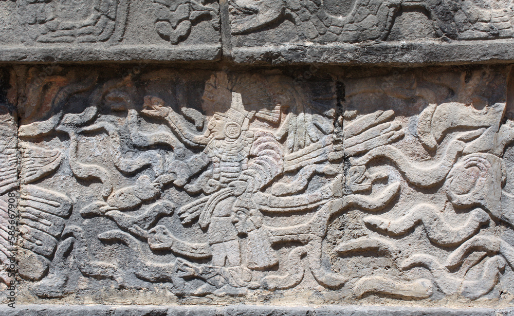 Bas-relief carving with indian warrior and serpents, pre-Columbian Maya civilization, Chichen Itza, Yucatan, Mexico