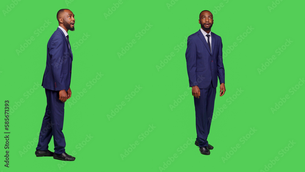 African american businessman saying wow being surprised, having shocked reaction in studio with greenscreen backdrop. Male employee in suit feeling amazed on camera, amazing surprise. African american businessman saying wow being surprised, having shocked reaction in studio with greenscreen backdrop. Male employee in suit feeling amazed on camera, amazing surprise.