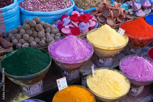 Colorful soaps, spices and perfumes for sale in a market in a souk in the Medina around the Jemaa el-Fnaa square in Marrakesh Morocco