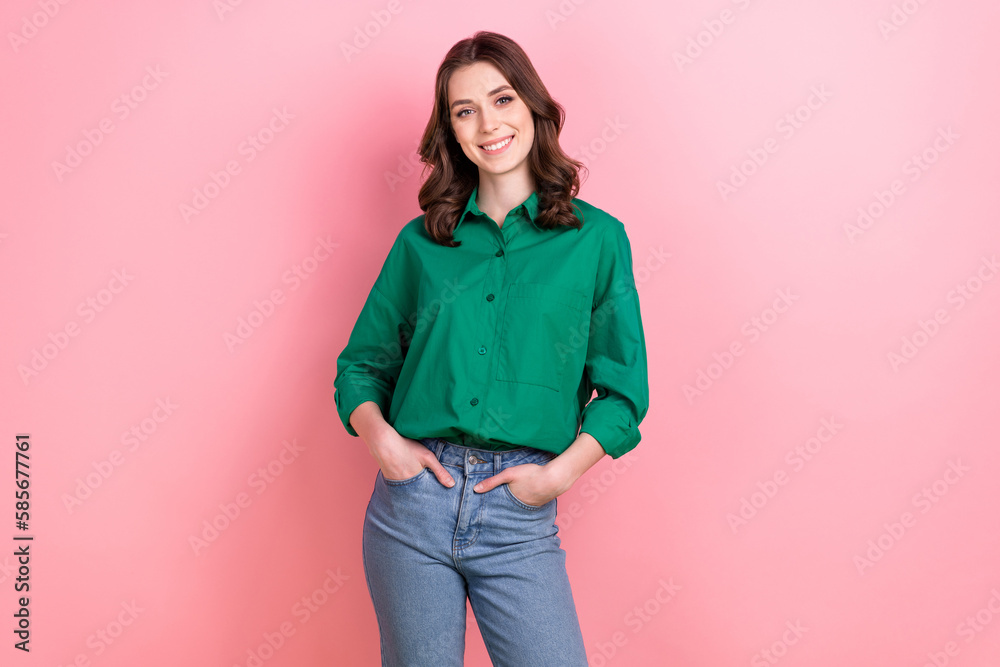 Photo of positive stunning lady put hands pockets posing toothy smile isolated on pink color background Photo of positive stunning lady put hands pockets posing toothy smile isolated on pink color background