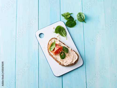 Studio shot of ready-to-eat sandwich with cream cheese, salami and spinach