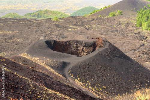 Lunar landscape on Mount Etna. Volcanic ashes and black stone created by eruptions and lava. Silvestri Craters photo