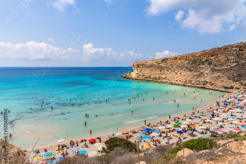 Isola dei Conigli (Rabbit Island) and its beautiful beach with turquoise sea water. Lampedusa, Sicily, Italy. photo