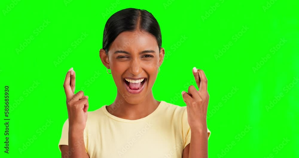 Hope, fingers crossed and woman in studio with green screen with a wish to win or success. Happy, smile and portrait of Indian female model with luck hand gesture isolated by a chroma key background. Hope, fingers crossed and woman in studio with green screen with a wish to win or success. Happy, smile and portrait of Indian female model with luck hand gesture isolated by a chroma key background.