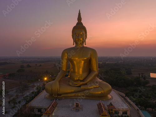 aerial view beautiful sky in twilight at the Biggest Buddha in the world at wat Maung Angtong Thailand. scenery sky in twilight background.the one famous landmarks in Thailand. © Narong Niemhom