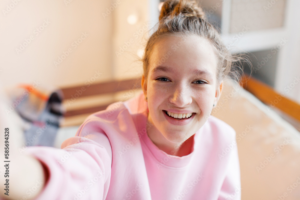 Happy teen girl blogger talking to camera video calling, recording vlog Happy teen girl blogger talking to camera video calling, recording vlog