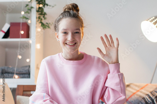 Cuadro en lienzo Happy teen girl blogger talking to camera video calling, recording vlog