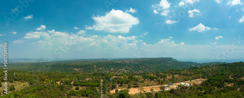 aerial view above a Group of Wind turbine on mountain at day time in Lam Takong Dam, Nakhon Ratchasima, Thailand
white cloud in blue sky background.Wind power generates electricity. Clean energy from 