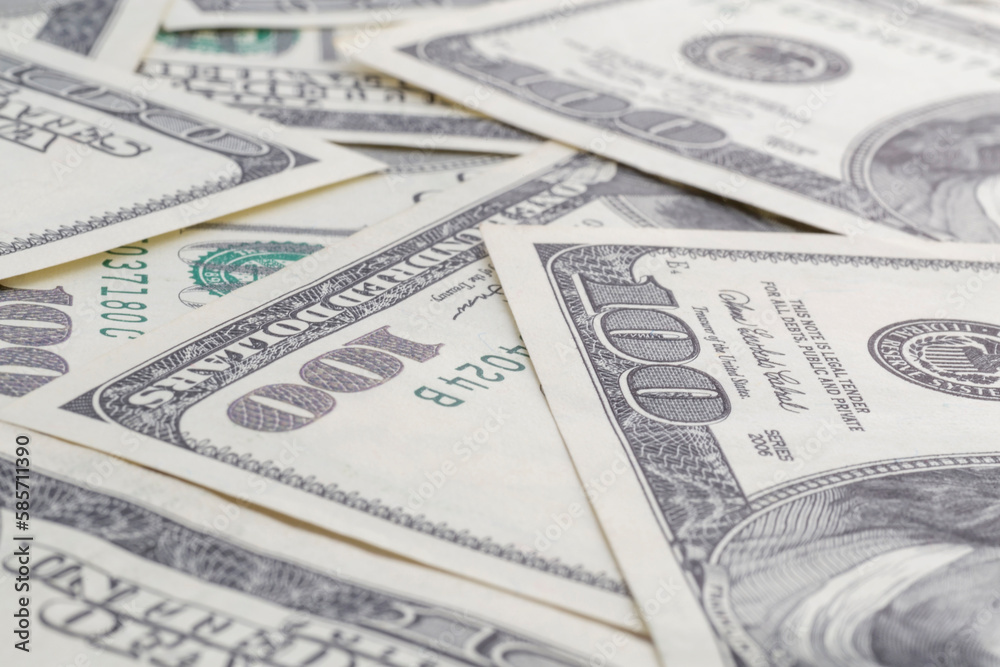 heap of one hundred US dollars banknotes heap of one hundred US dollars banknotes
