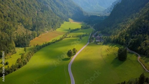 Aerial 4K footage of Velika Planina or the Big Pasture Plateau is a karstified mountain plateau in the Kamnik–Savinja Alps northeast of Kamnik, Slovenia. photo
