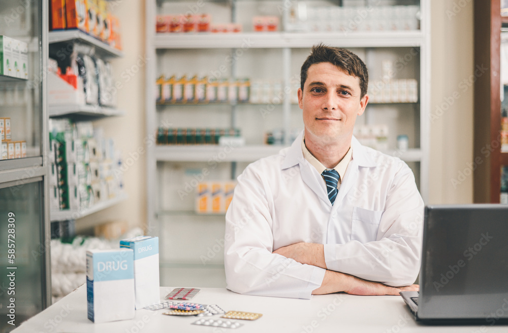 Male pharmacist posing confidently welcoming, advising patients and prescription patients in modern pharmacy.