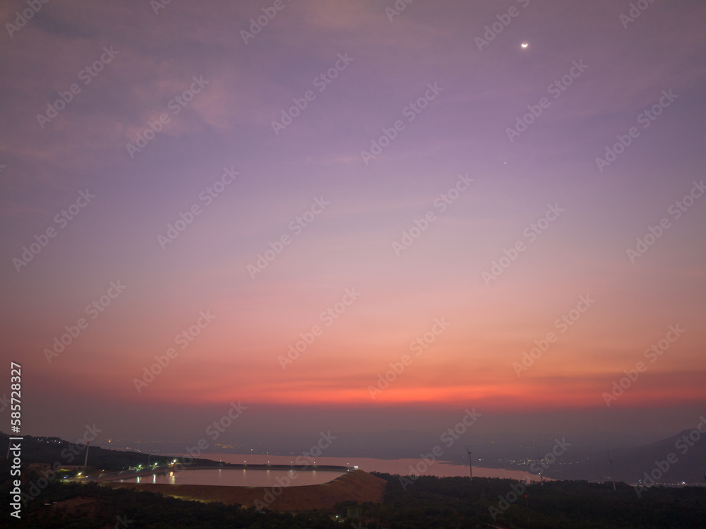 aerial view wind turbine viewpoint at Lamtakong dam,Nakhonratchasima, Thailand.
amazing sky of sunset above Lamtakong dam beautiful reflection on the large pond.
Gradient color. Sky texture, 