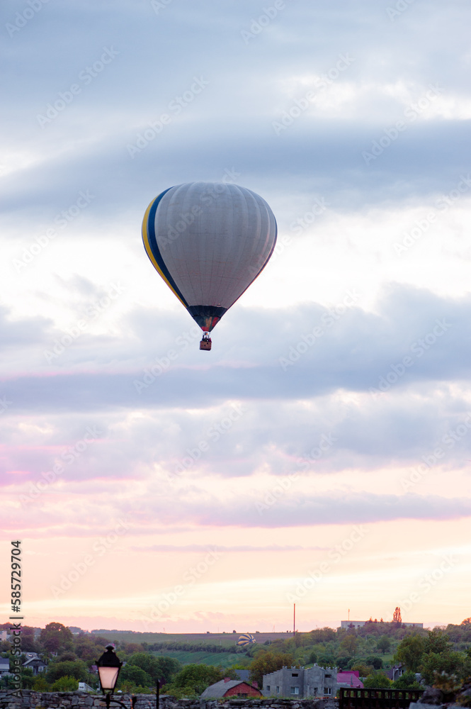 Aerostatics and aeronautics. Airballoon against sky.