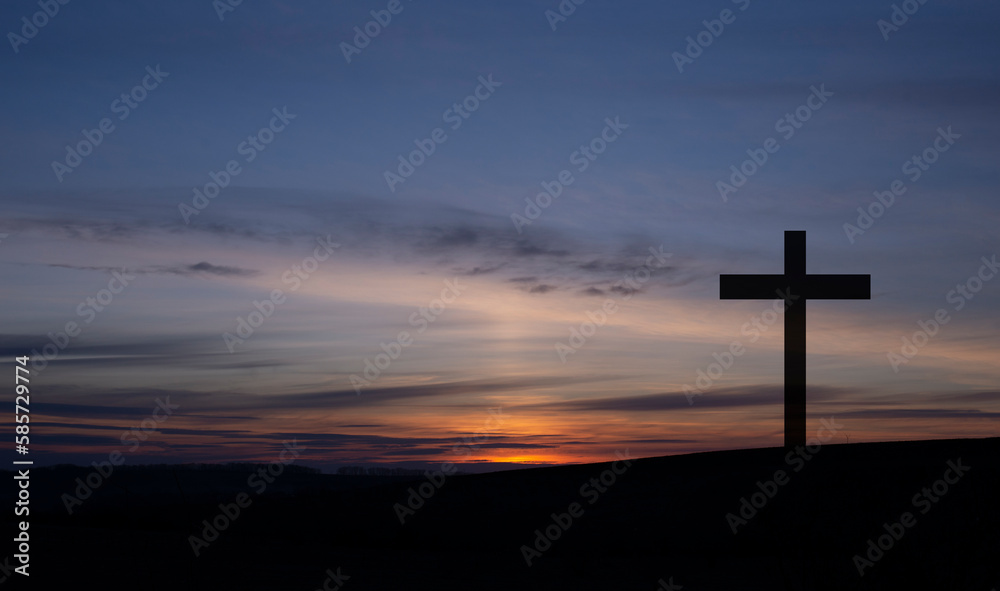 Cross on the background of the sky. Crucifixion on the background of the sunset. Forgiveness of sins. The death of Jesus. Easter