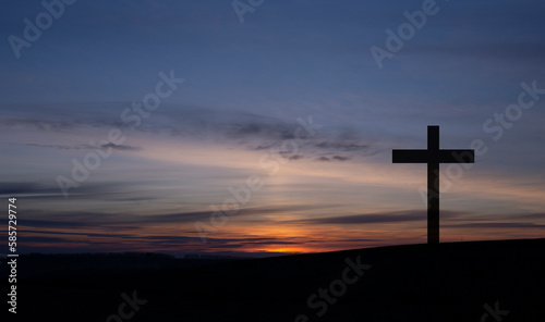Cross on the background of the sky. Crucifixion on the background of the sunset. Forgiveness of sins. The death of Jesus. Easter