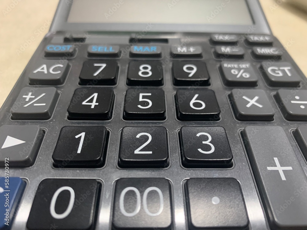 close up of calculator on the table, number 1 2 3 4 5 6 7 8 9 0 00 close up of calculator on the table, number 1 2 3 4 5 6 7 8 9 0 00