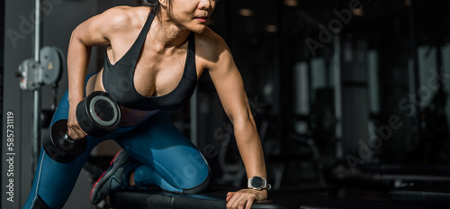 Concepts healthy lifestyle and workout exercise. Muscular Building Workout, Fitness muscular body, Fitness, Gym. Fitness Asian Women exercising are lifting dumbbells