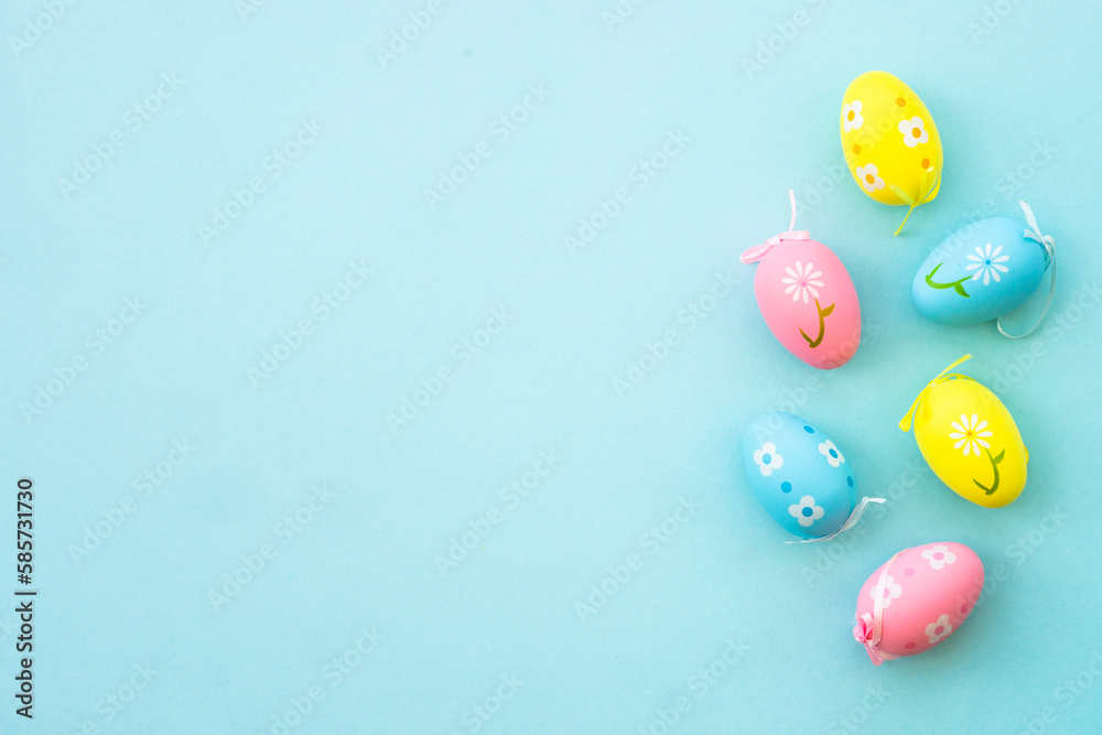 Easter eggs on blue background. Flat lay with copy space. Easter eggs on blue background. Flat lay with copy space.