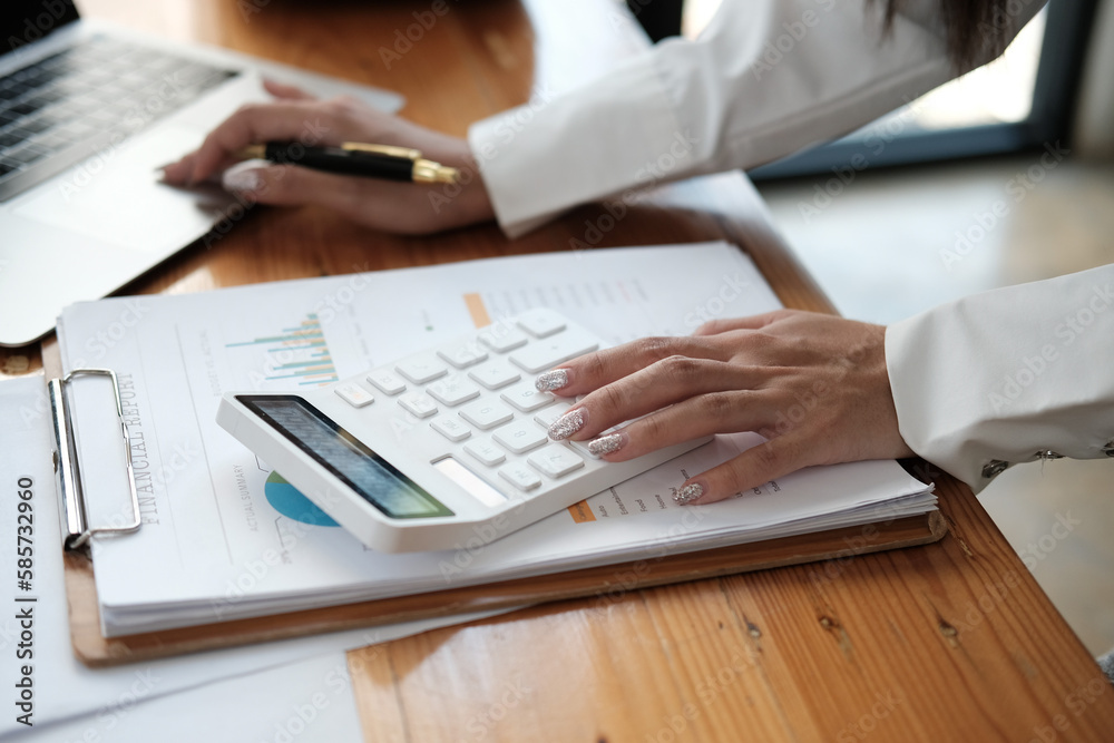 Startup small business SME. Beautiful asian entrepreneur using calculator, check online order and prepare to packing for customer. Successful SME business online concept. Startup small business SME. Beautiful asian entrepreneur using calculator, check online order and prepare to packing for customer. Successful SME business online concept.