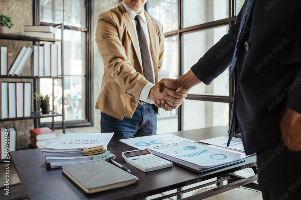 Business people shaking hands at meeting or negotiation, close-up. Group of unknown businessmen and women in modern office. Teamwork, partnership and handshake concept, toned Business people shaking hands at meeting or negotiation, close-up. Group of unknown businessmen and women in modern office. Teamwork, partnership and handshake concept, toned
