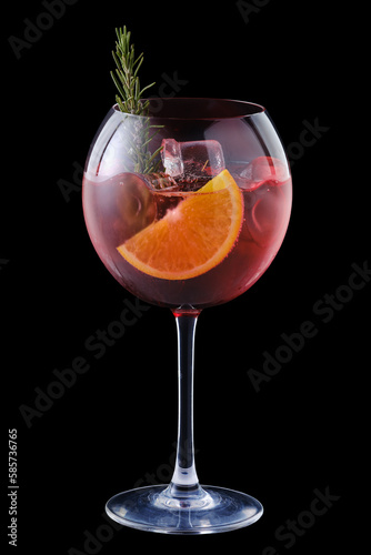 Cold sangria with orange and rosemary in a wine glass