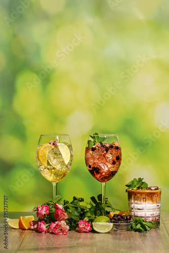 Set of cold sangria and iced coffee summer drinks on wooden table with ingredients