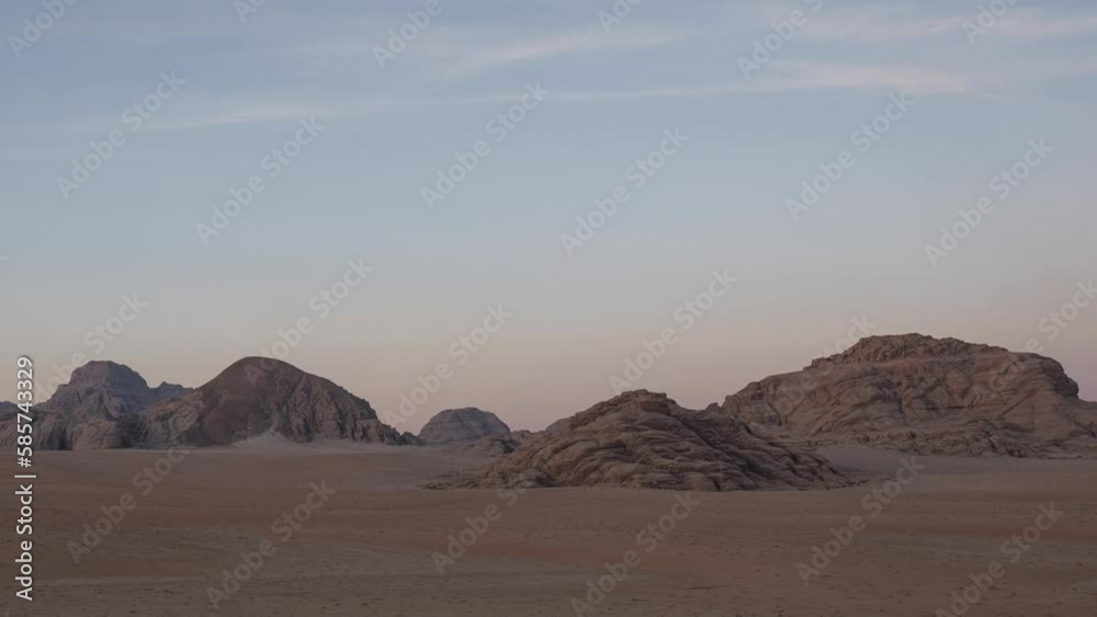 Sunrise over rocky mountains in the Wadi Rum desert, Jordan, Middle East Sunrise over rocky mountains in the Wadi Rum desert, Jordan, Middle East