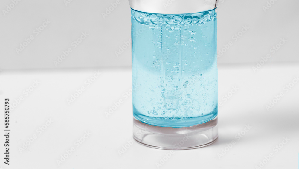 Hyaluronic acid in glass bottle on white background with clipping path close-up, Liquid blue gel or serum bubbles, Medicine and Pharmacology. Beauty skin care concept Beauty and spa. Hyaluronic acid in glass bottle on white background with clipping path close-up, Liquid blue gel or serum bubbles, Medicine and Pharmacology. Beauty skin care concept Beauty and spa.