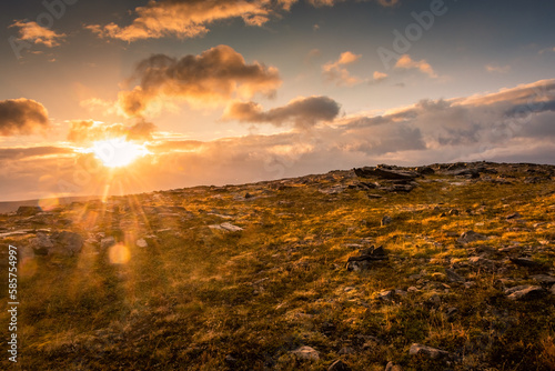 Quadro su tela Midnight sun rising over Knivskjellodden, a trail in the tundra towards the true