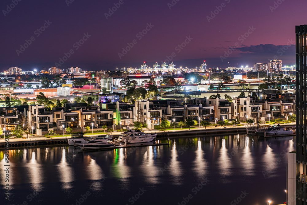 Yarra River and real estate buildings at night