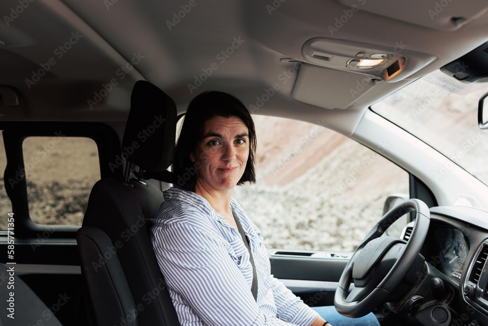 Woman waiting inside her car Woman waiting inside her car