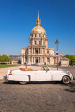 View of Les Invalides with vintage car (Lincoln) in Paris, France