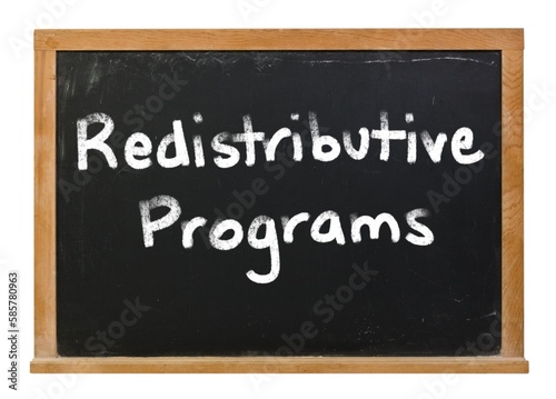 Redistributive programs written in white chalk on a black chalkboard isolated on white