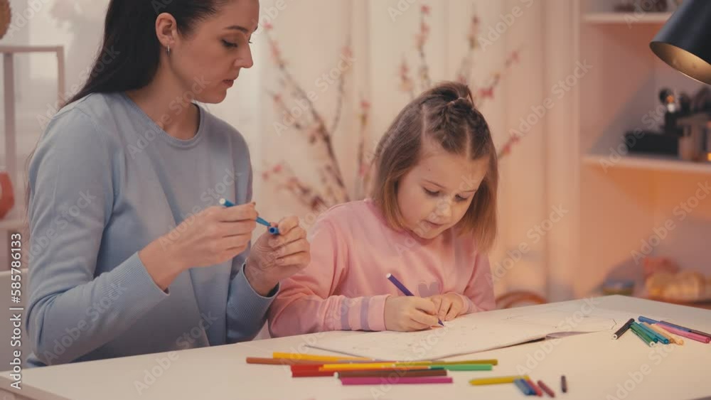 Mother and little daughter draw together at home, happy childhood, DIY activity Mother and little daughter draw together at home, happy childhood, DIY activity